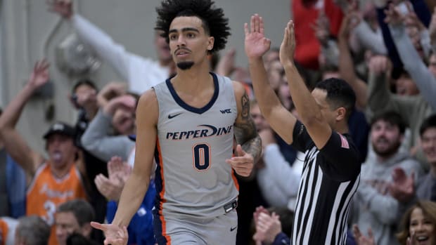 Jan 18, 2024; Malibu, California, USA; Pepperdine Waves guard Houston Mallette (0) heads down court after a 3-point basket in the first half at Firestone Fieldhouse. Mandatory Credit: Jayne Kamin-Oncea-USA TODAY Sports  